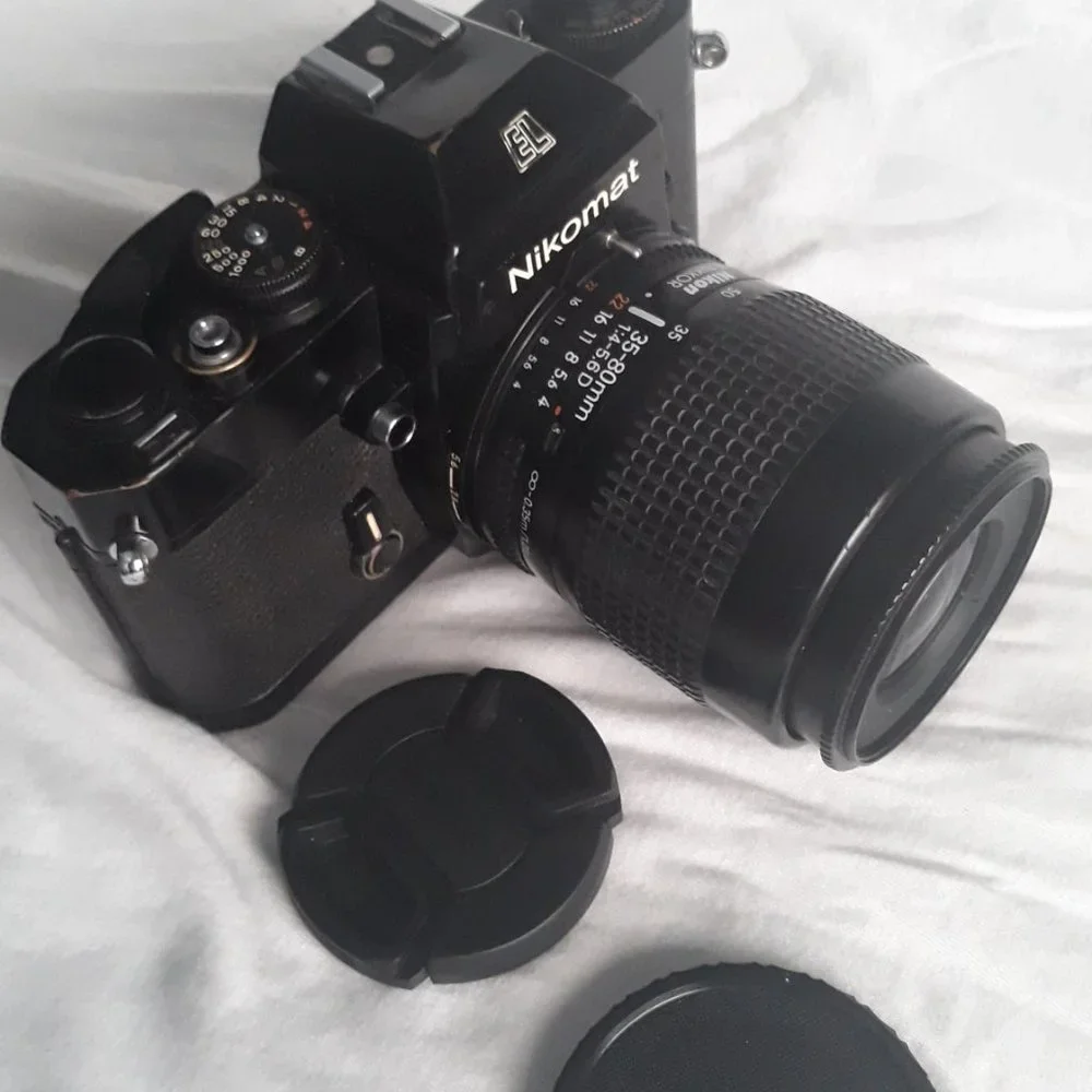 Nikon Nikkomat EL Nikkor 35-80mm 4-5.6D Zoom lens. Leather case